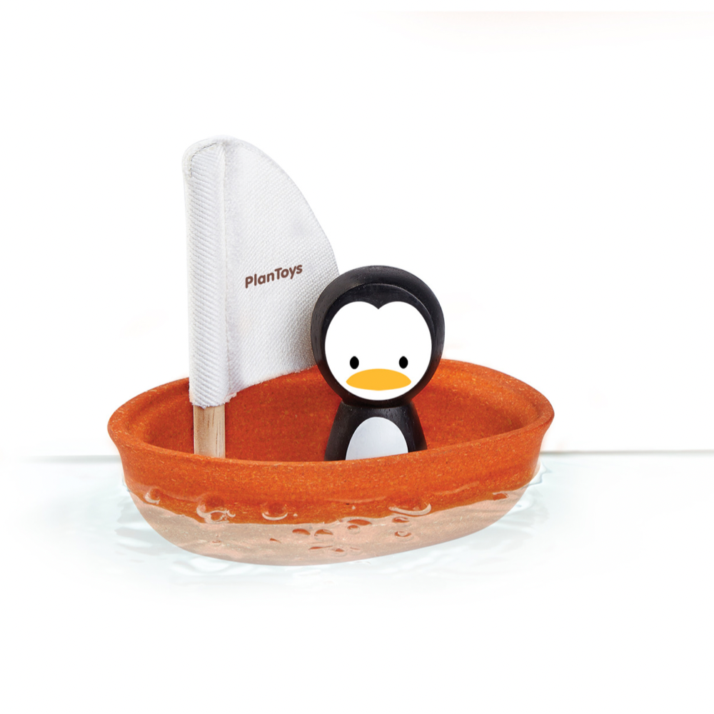 Badspeelgoed zeilboot met pinguïn